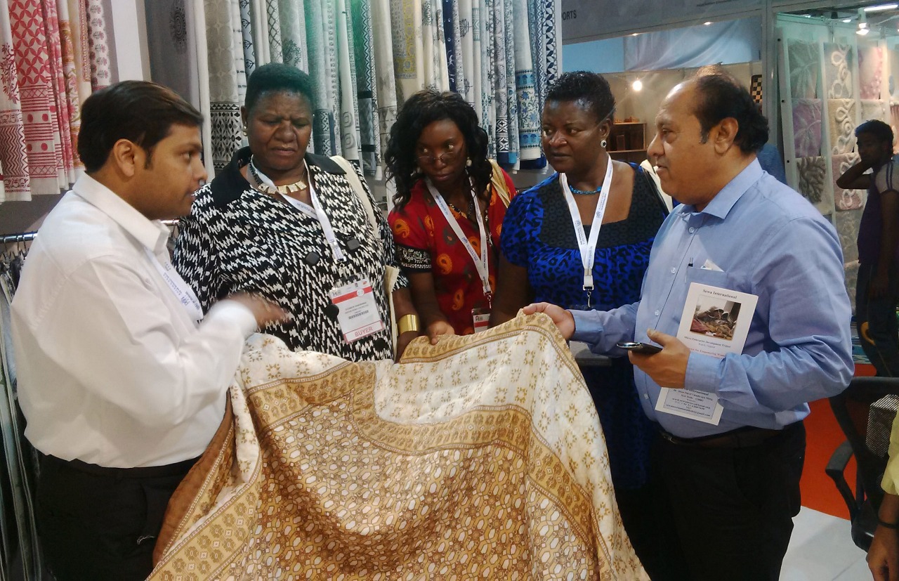 Block-printed fabric being shown to visiting buyers